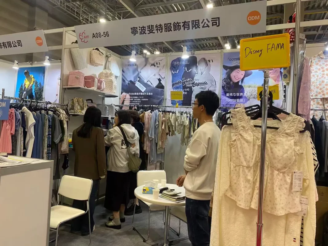 Exfatter Apparel booth at AFF Tokyo 2025 showcasing bamboo babywear