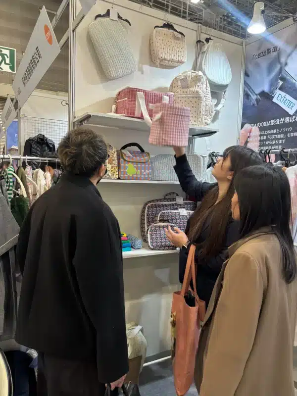 Exfatter Apparel booth at AFF Tokyo 2025 showcasing bamboo babywear